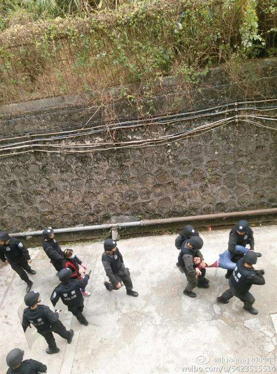 Chinese police taking away striking workers by force