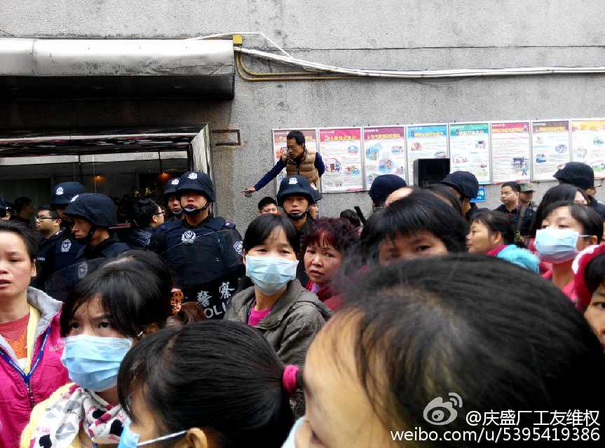 Striking workers surrounded by police
